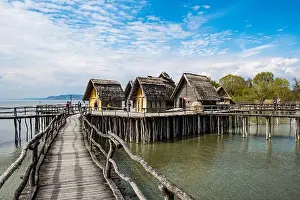 Incidental People Prints: Germany, Unteruhldingen, Stilt houses on Lake Constance open-air archeological museum