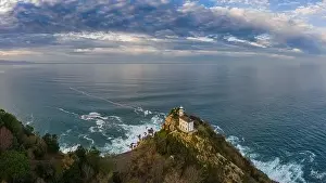 Getaria lighthouse at dusk, Basque country - drone aerial view 16:9