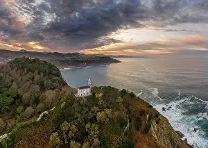 Getaria lighthouse at dusk, Basque country - drone aerial view