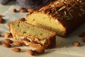 Cardamom Prints: Ghee cake slice. Vanilla flavoured ghee cake with almonds on top