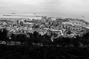 Macaque Prints: Gibraltar harbour from the rock view views water sea football ground boats boat Morocco town city flats tall buildings