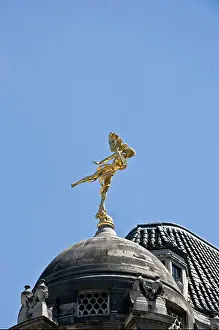 Domed Prints: Gilded bronze winged statue of Ariel by Sir Charles Wheeler on grade 1 listed Bank of England cupola Threadneedle