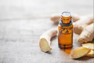 Aromatherapy Prints: Ginger essential oil in a small bottle. Selective focus. nature