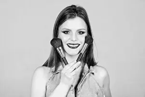 Lipstick Prints: Girl apply eye shadows. Woman applying makeup brush