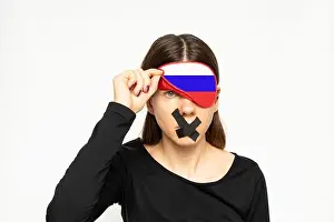 Lies Prints: A girl with a blindfold in the color of the flag of Russia and a band-aid closed her mouth on a white background