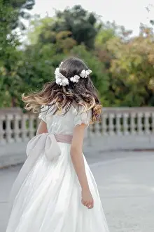 Solemn Prints: Girl celebrating communion in white dress, flower crown, and pink bow