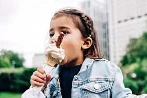 Icecream Prints: Girl eating ice cream at public park