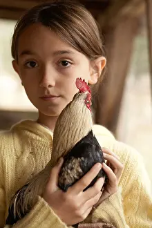 Preteen Prints: Girl holding her chicken at her farm
