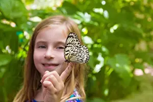 Careful Prints: Girl holding finger Rice Paper butterfly Idea leuconoe in outdoor