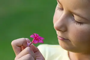 Smelling Prints: Girl looking at flower