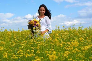 Smell Prints: a girl in the national costume of Ukraine in a field of flowers
