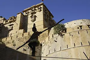 Tourist Spot Prints: Girl performing acrobatics on rope sonar fort jaisalmer Rajasthan India