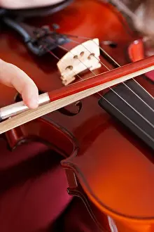 Violin Prints: girl playing violin - strings and bow close up