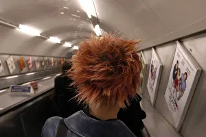Spikey Prints: girl with red hair on escalator london underground tube system