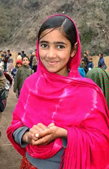 Earthquake Prints: A girl smiles at an open-air school near the city of Muzaffarabad