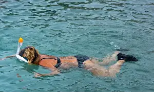 Tropical Waters Prints: Girl snorkeling, looking for turtles Curaçao