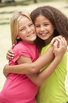 Having Fun Prints: Two Girls In Park Giving Each Other Hug