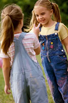 Face To Face Prints: Two girls standing on a lawn