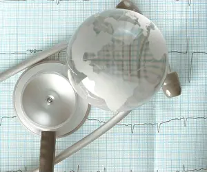Concern Prints: Glass globe and stethoscope over the ECG trace, concept of diagnosis of cardiac diseases