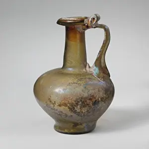Strap Prints: Glass jug 1st century A.D. Roman Small one-handled jugTranslucent yellow green; handle in same color