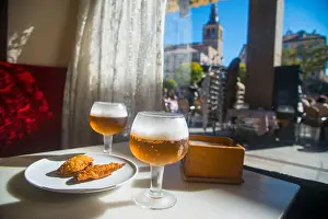 Cafeteria Prints: Two glasses of beer and tapa in a cafe. Plaza Mayor, Segovia, Spain