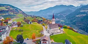 Gloomy autumn view from flying drone of Pfarrkirche Feldthurns Church