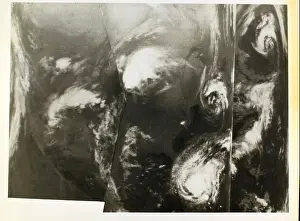 Forecasting Prints: This glossy photo showcases the Tiros satellite