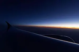 Glowing horizon over a wingtip