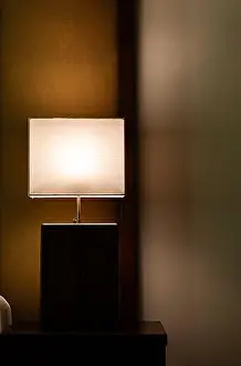 Bedtime Prints: Glowing lamp on nightstand In the evening