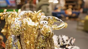 Reindeer Prints: Gold reindeer toys with for christmas decoration displayed in shop