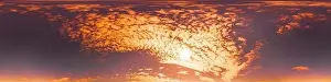 Golden glowing red orange sunset sky panorama