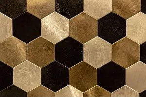 Hexagonal Prints: Golden hexagon cell tiling on the luxury decoration interior Gold metal honeycomb