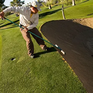 Lean Prints: golf raking the sand bunker