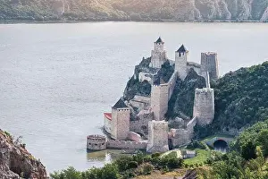 Golubac Fortress in Serbia, a historic landmark overlooking the blue Danube, captured from above on a sunny summer day