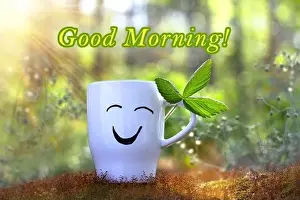 Wake Up Prints: Good morning. Positive cup with smile on sunny green background of nature. Good day wishes