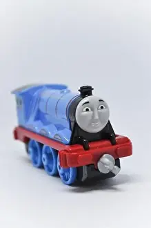 Magnetic Prints: Gordon die cast model from Thomas the Tank Engine set against a white background