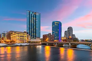 Grand Rapids, Michigan, USA downtown skyline on the Grand River at dusk
