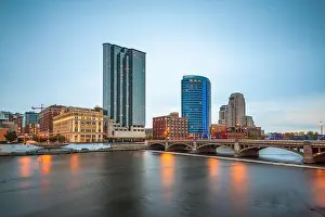 Grand Rapids, Michigan, USA downtown skyline on the Grand River at dusk