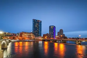 Grand Rapids, Michigan, USA downtown skyline on the Grand River at dusk