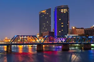 Grand Rapids, Michigan, USA downtown skyline on the Grand River at dusk