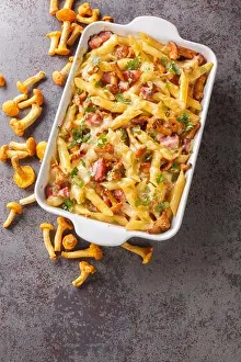 Casserole Prints: Gratin prepared from penne pasta with chanterelle mushrooms