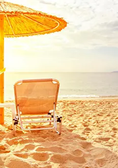 Getaway Prints: Gray straw umbrella on beautiful beach and ocean with burning sun