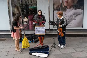 Classical Music Prints: Graz, Austria - 10.19.2025: Street Musicians Performing Violin Trio in Graz City Center