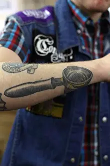 Connoisseur Prints: Great Britain / England / London / Barista with portafilter tattoo on his arm