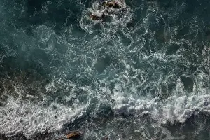 Swell Prints: Great waves in the Atlantic Ocean that are illuminated by the sun and therefore shine so beautifully