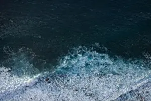 Swell Prints: Great waves in the Atlantic Ocean that are illuminated by the sun and therefore shine so beautifully