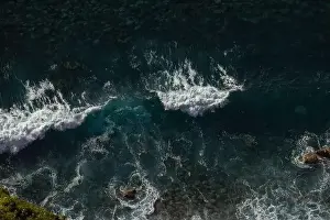 Great waves in the Atlantic Ocean that are illuminated by the sun and therefore shine so beautifully