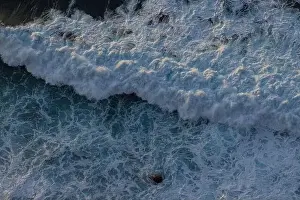 Swell Prints: Great waves in the Atlantic Ocean that are illuminated by the sun and therefore shine so beautifully