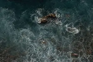 Swell Prints: Great waves in the Atlantic Ocean that are illuminated by the sun and therefore shine so beautifully
