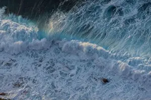 Swell Prints: Great waves in the Atlantic Ocean that are illuminated by the sun and therefore shine so beautifully